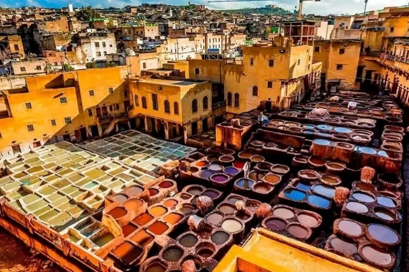 Vibrant pots in various colors adorn the streets of Marrakech, showcasing the city's rich culture and artistry.While best morocco tours .