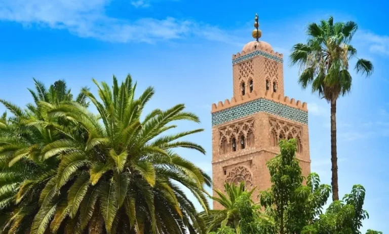 Clock tower of the mosque in Marrakech, Morocco, a prominent landmark and top attraction in the city.