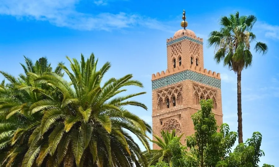 Clock tower of the mosque in Marrakech, Morocco, a prominent landmark and top attraction in the city.