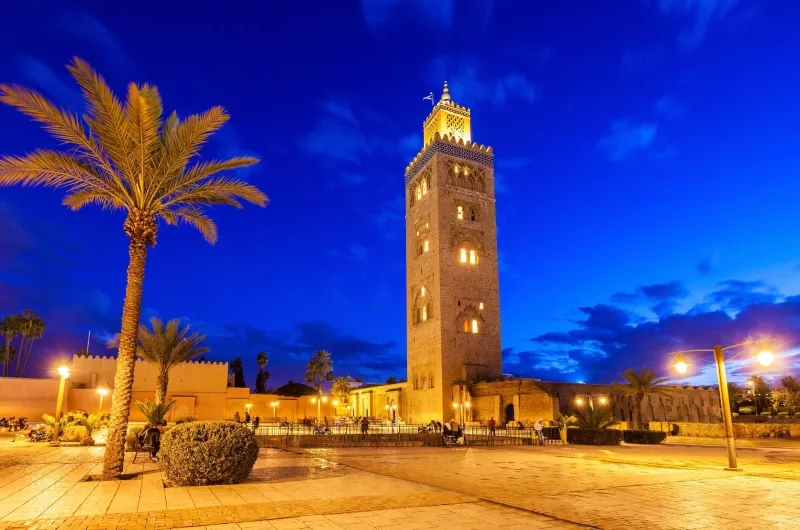 Clock tower of the mosque in Marrakech, Morocco, a notable landmark and attraction in the city.
