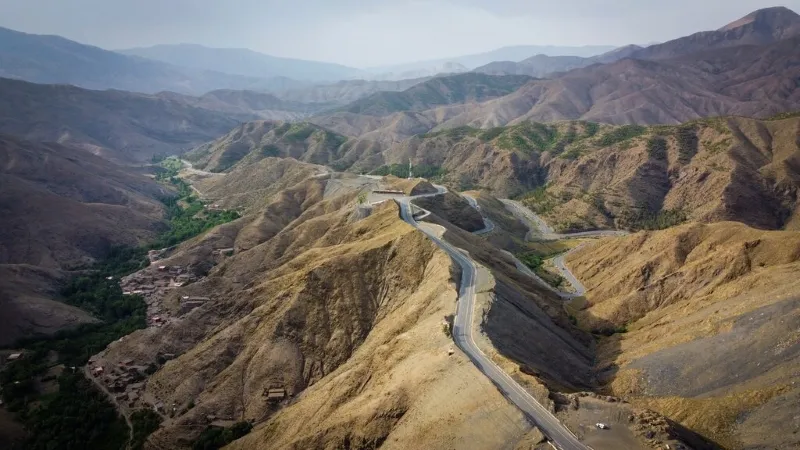 A panoramic view of the Great Wall of China, winding through mountains and valleys, symbolizing historical strength.
