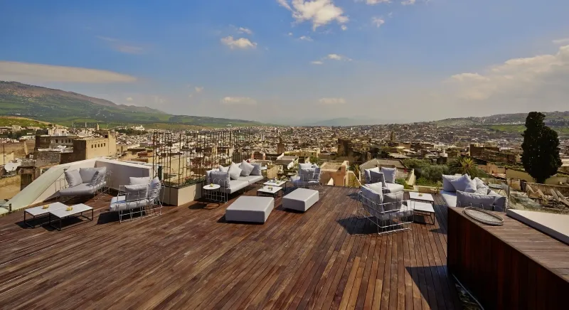 Rooftop terrace with a panoramic view of Fes, one of largest cities in Morocco , showcasing its urban landscape.